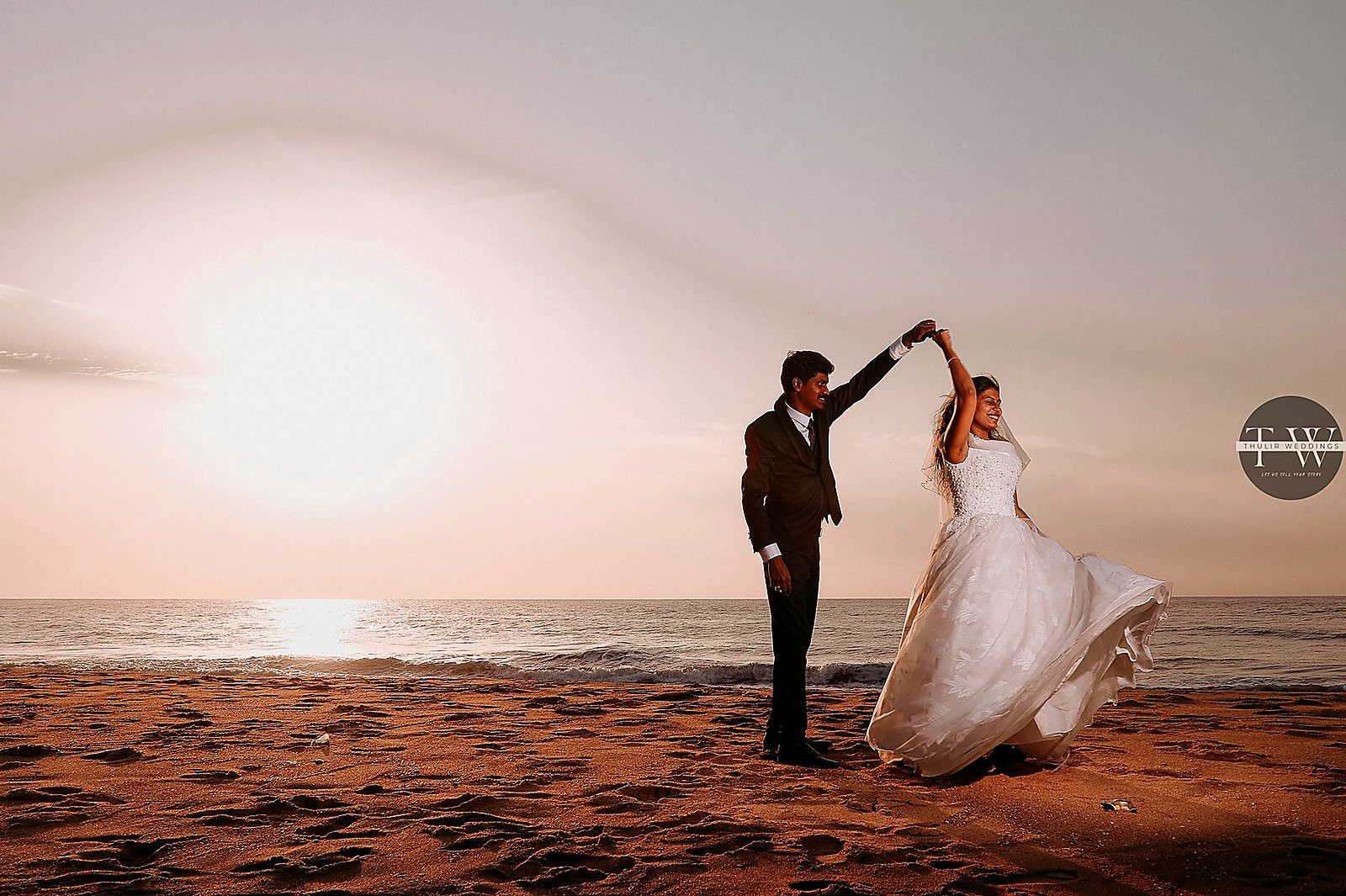 Couple dancing at sunset — Thulir Weddings