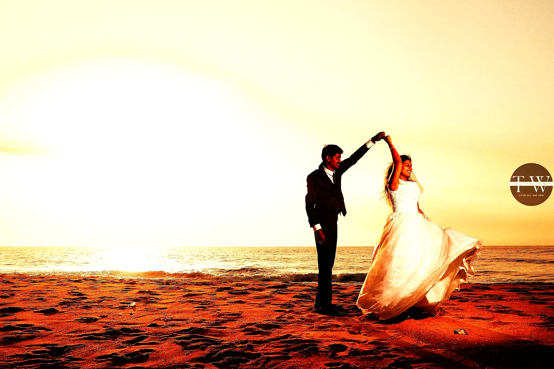 Couple dancing at sunset — Thulir Weddings